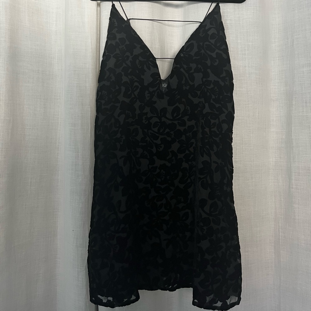 Black cocktail dress with velvet floral design.